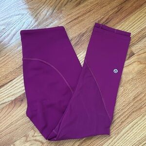 Lululemon high rise crop leggings with sheer panel and zipper design. Size 4